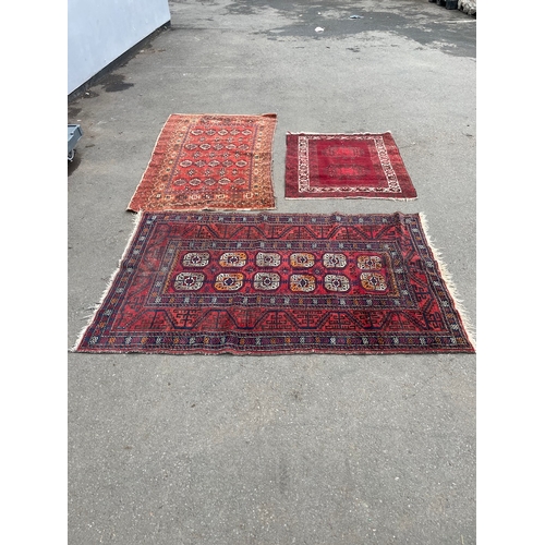 152 - Three vintage red rugs / carpets