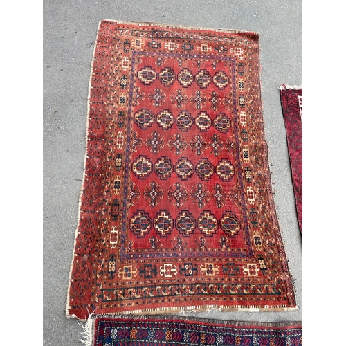 152 - Three vintage red rugs / carpets