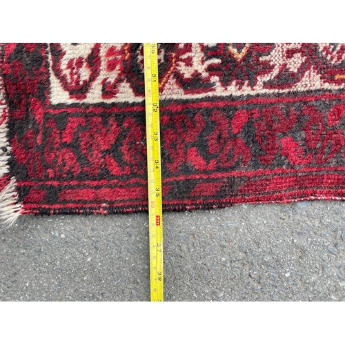 152 - Three vintage red rugs / carpets