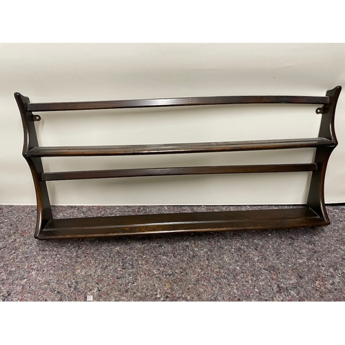 163 - Two Ercol plate wall racks