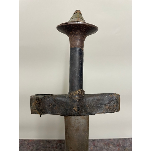 198 - Antique Sword possibly African (damage to sheath and tip of sword)