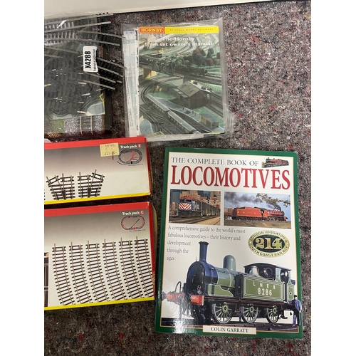 101 - Collection of locomotive and model railway books + Hornby accessories / tracks in box