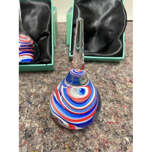 75 - Two matching boxed glass paperweights