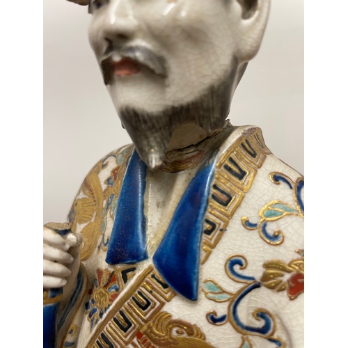 77 - Early 20th century oriental polychrome hand painted  ceramic figure of emperor - A/F - 37CM X