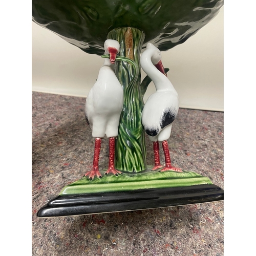 103 - 20th century porcelain raise bowl on a trio of birds - all in good order bowl looks to have been reg... 