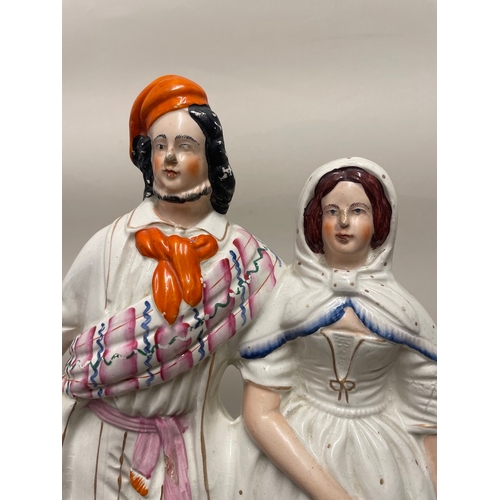 104 - 19th century Staffordshire porcelain figure of couple - hair line mark, chips to base as shown - 40c... 