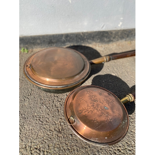 309 - Two Vintage Copper bed warmers. One Large, one small.