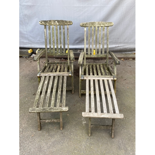 467 - Two Teak Reclining Garden Loungers / Steamers .(with wheels).