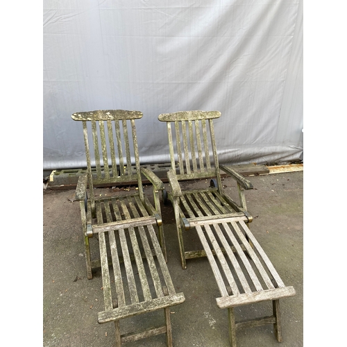 467 - Two Teak Reclining Garden Loungers / Steamers .(with wheels).