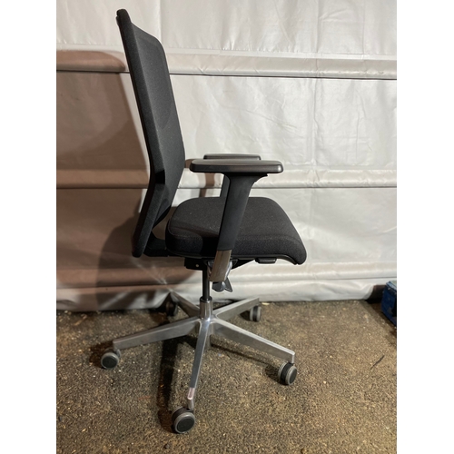 302 - Set of four black adjustable office chairs.