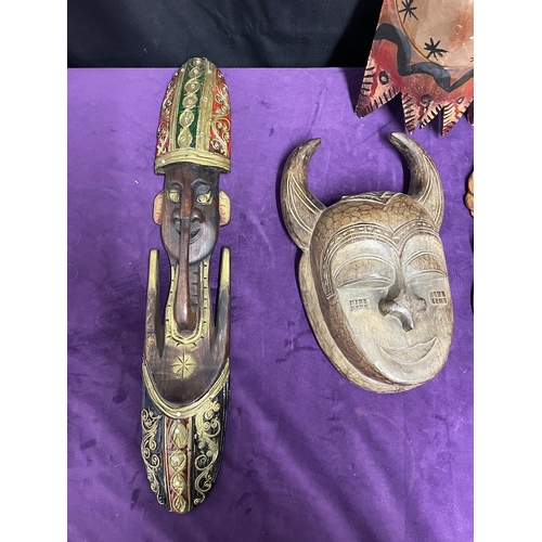 25 - Collection of tribal masks / wall hangings