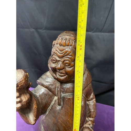 52 - Hand carved sculptor of a monk toasting - 52cm