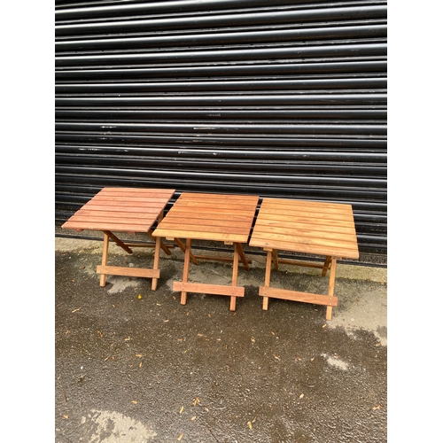 357 - Teak Three small foldable garden wooden tables.