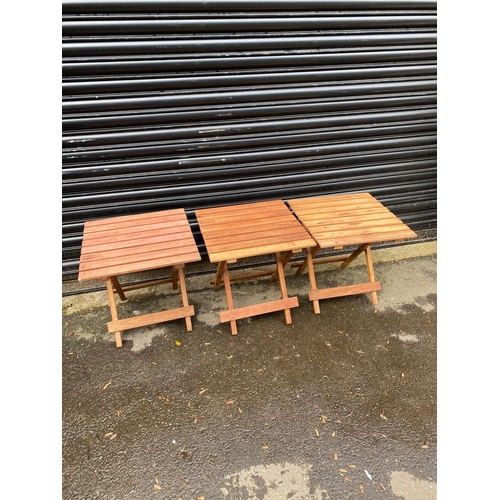 357 - Teak Three small foldable garden wooden tables.