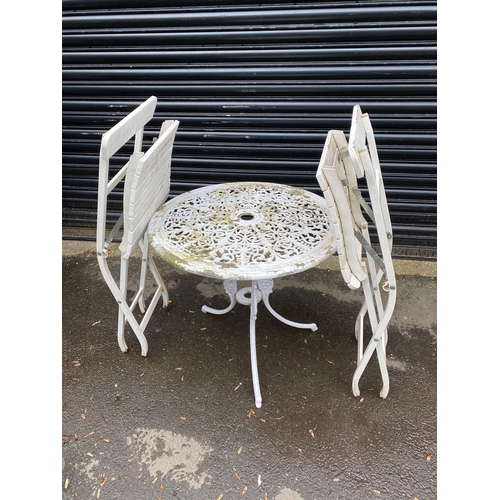 359 - White metal garden table with two white foldable chairs.