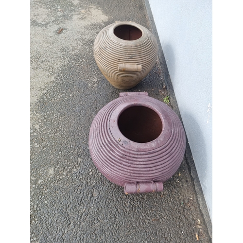 374 - Two terracotta ribbed flower / garden pots.