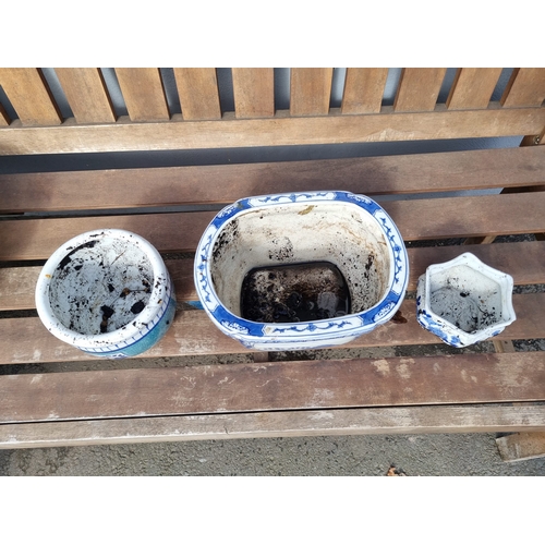 376 - Three oriental themed decorative blue and white flower pots.