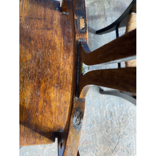 498 - Two antique chairs - One rush seated armchair and one dining chair.

See images for dimensions.