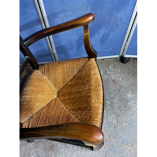 498 - Two antique chairs - One rush seated armchair and one dining chair.

See images for dimensions.