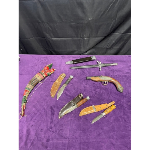 24 - Quantity of vintage / reproduction daggers / Knives + ornate pistol