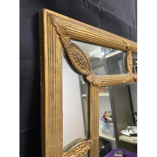 51 - A Regency Gilt Cushion Wall Mirror, plated rectangle centred panel separated by reeded and floral mo... 