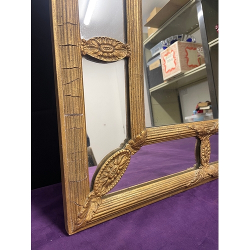 51 - A Regency Gilt Cushion Wall Mirror, plated rectangle centred panel separated by reeded and floral mo... 