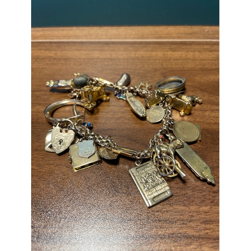 192 - Vintage 9ct yellow gold charm bracelet 
majority 9ct hallmarked  9 charms are plated / unmarked  - t... 