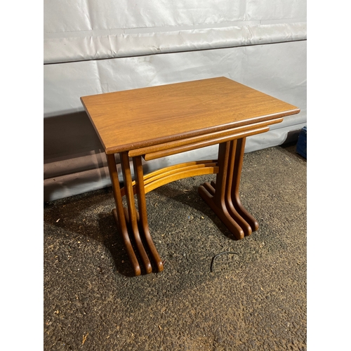 210A - Mid Century Teak G Plan Nest of three tables. 

Dimension of biggest table - 22