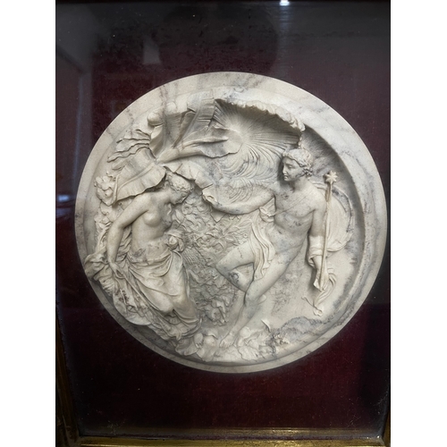 151 - A Framed Victorian High Relief Marble circular panel depicting two allegorical figures on a leaf and... 