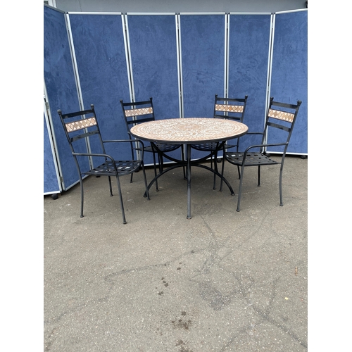 225 - Metal garden table and four stackable chairs with tiled mosaic design. 

See images for dimensions.