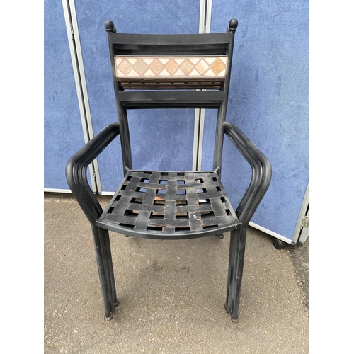 225 - Metal garden table and four stackable chairs with tiled mosaic design. 

See images for dimensions.