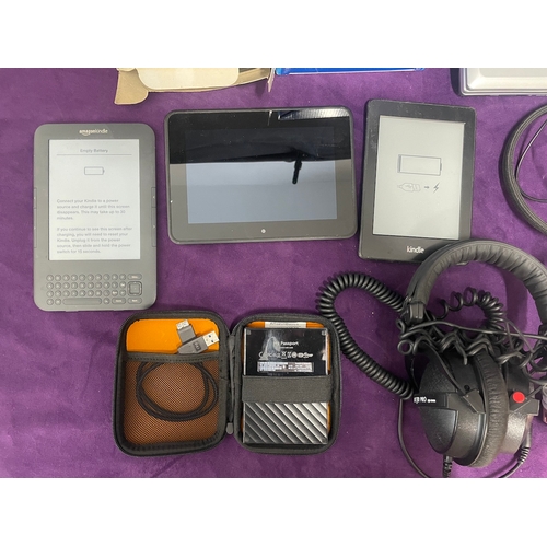 29 - Quantity of electronics, kindles, headphones