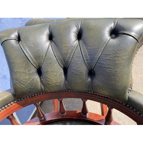 257 - A lot of two matching Vintage green leather button back captains office/library chairs

Please see i... 