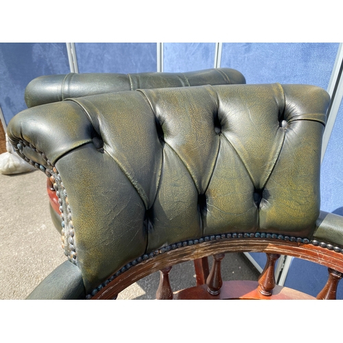 257 - A lot of two matching Vintage green leather button back captains office/library chairs

Please see i... 