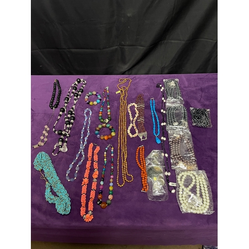 89 - Quantity of various coloured necklaces / some glass beads / pearls some with 375 stamped gold clasps