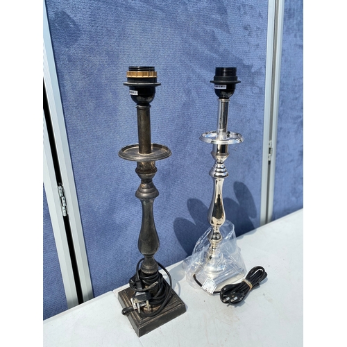 298 - Two candle stick design table lamps.

**Two prong plug**