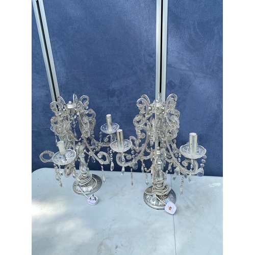 304 - A pair of chandelier style bedside/table top lamps.