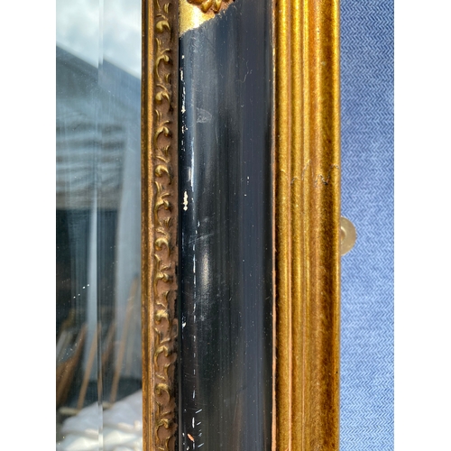 308 - Large Vintage gilt on black framed rectangular mirror

Dimensions - 46