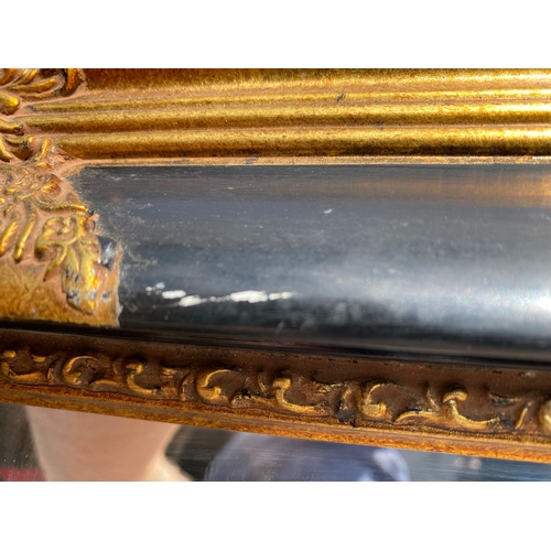 308 - Large Vintage gilt on black framed rectangular mirror

Dimensions - 46