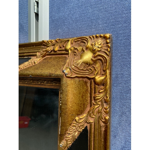 308 - Large Vintage gilt on black framed rectangular mirror

Dimensions - 46