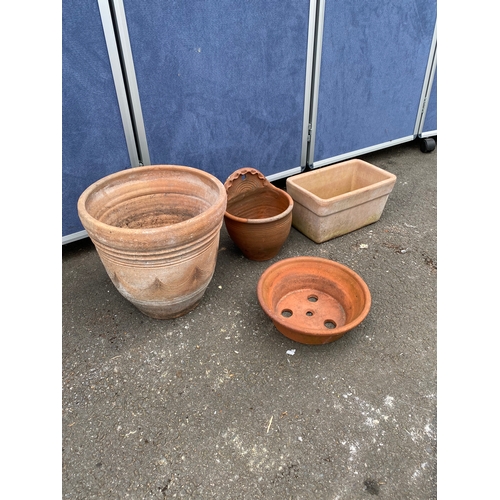 396 - A collection of terracotta pots