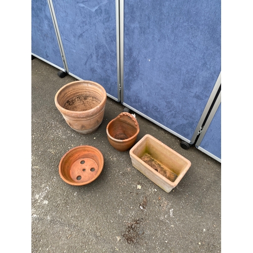 396 - A collection of terracotta pots