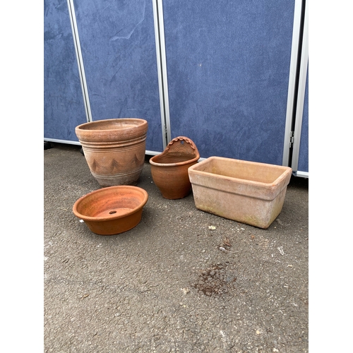 396 - A collection of terracotta pots