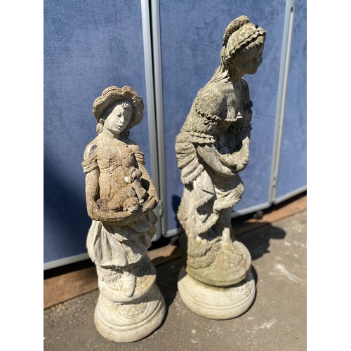 404 - A pair of stone statues depicting young girls holding dogs and a bird