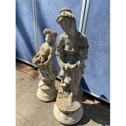 404 - A pair of stone statues depicting young girls holding dogs and a bird