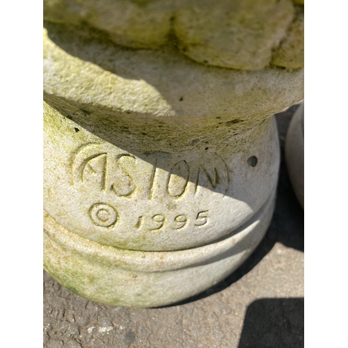 404 - A pair of stone statues depicting young girls holding dogs and a bird