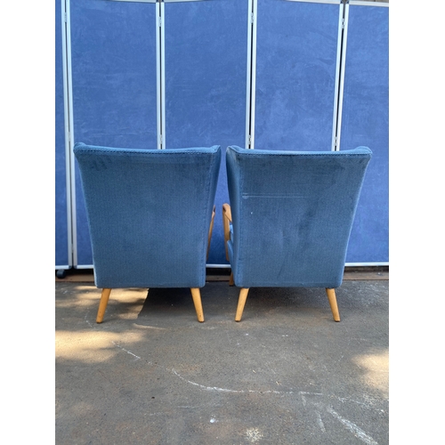 423 - A pair of Bambino Armchairs by Howard Keith c 1950's in blue fabric upholstery