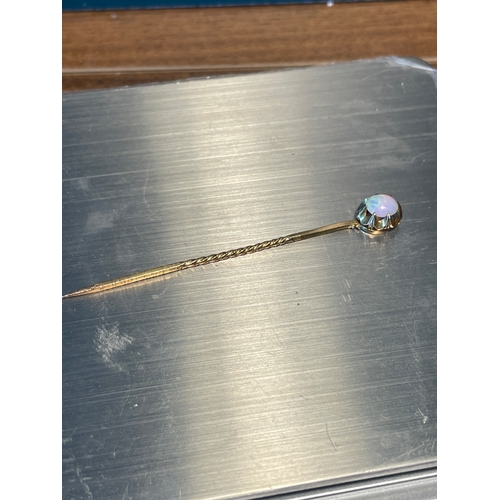 107 - Vintage yellow gold hair pin - unmarked testing as 9ct with a brilliant Opal approx 2ct - 1.7g