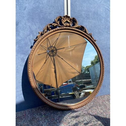 479 - An Ornate circular gilt mirror

Dimensions - 27.5