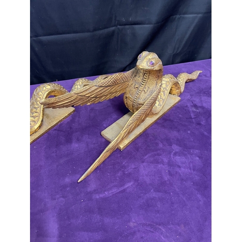 184 - A pair of gilded winged serpent mythical interior design ornaments - carved wood 61cm x 20cm each